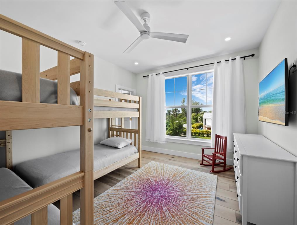 630 Companion Way Longboat Key, FL 34228 - Photo 29 of 66 a bed room with furniture and a large window