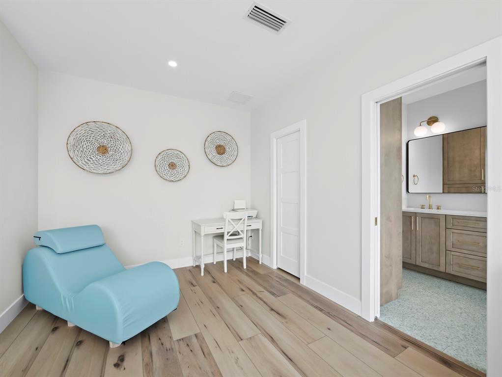 630 Companion Way Longboat Key, FL 34228 - Photo 34 of 66 a living room with furniture and a wooden floor