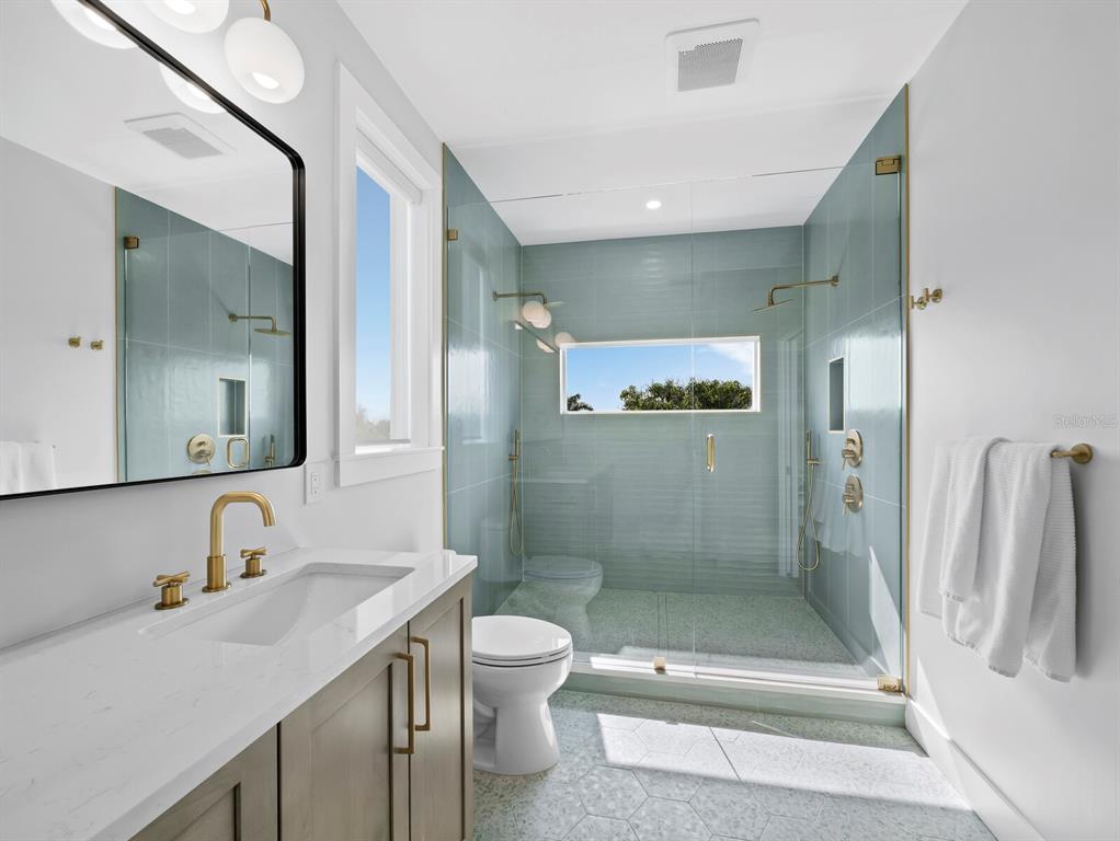 630 Companion Way Longboat Key, FL 34228 - Photo 35 of 66 a bathroom with a sink a toilet and shower