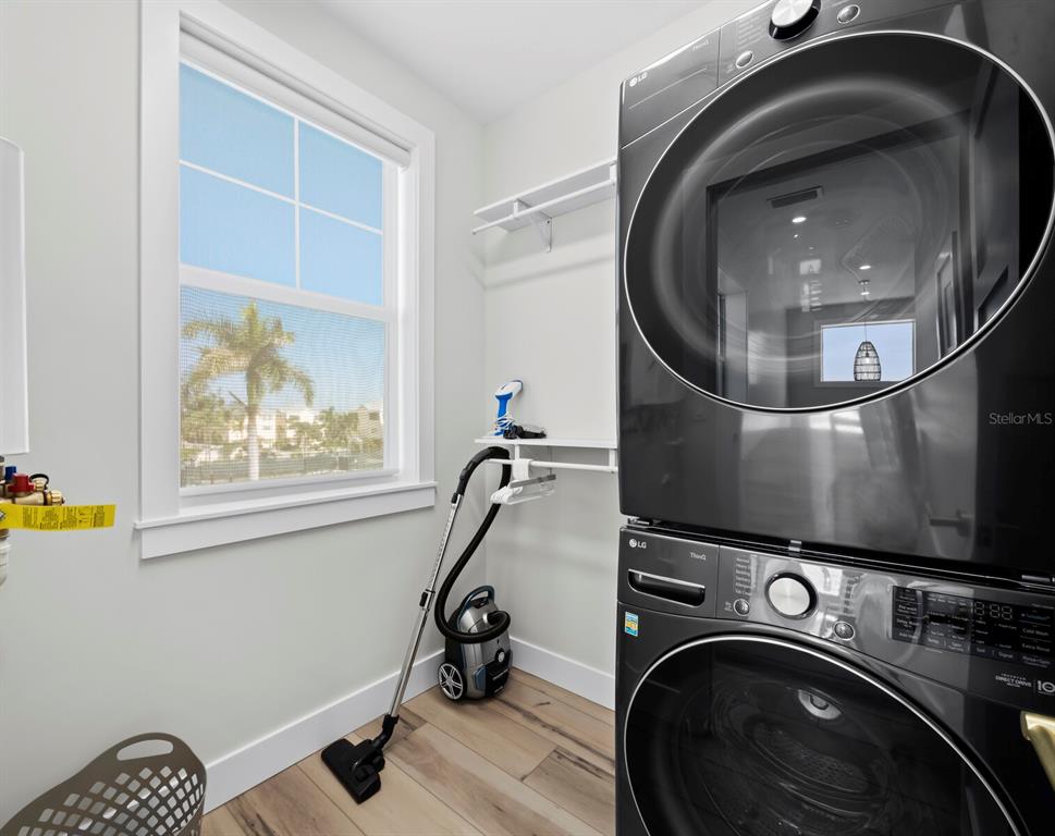 630 Companion Way Longboat Key, FL 34228 - Photo 36 of 66 a utility room with dryer and washer