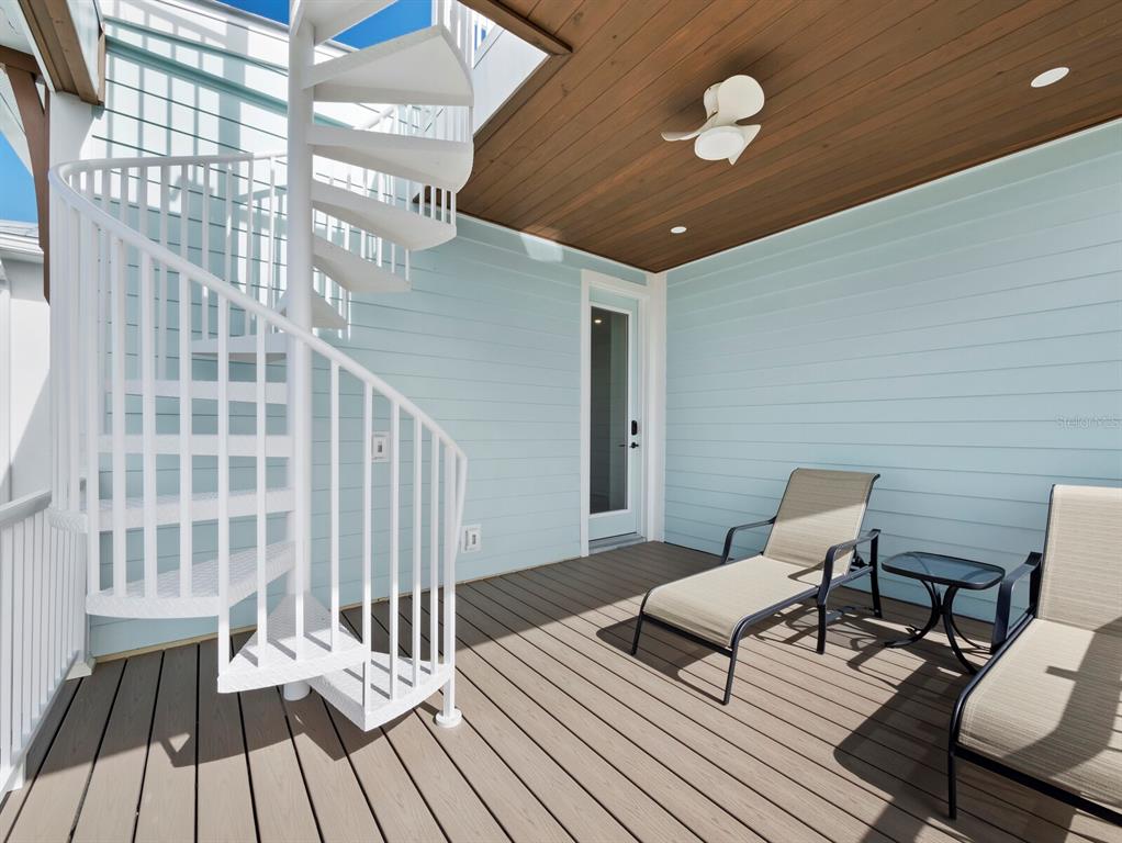 630 Companion Way Longboat Key, FL 34228 - Photo 38 of 66 a living room with furniture and a chandelier