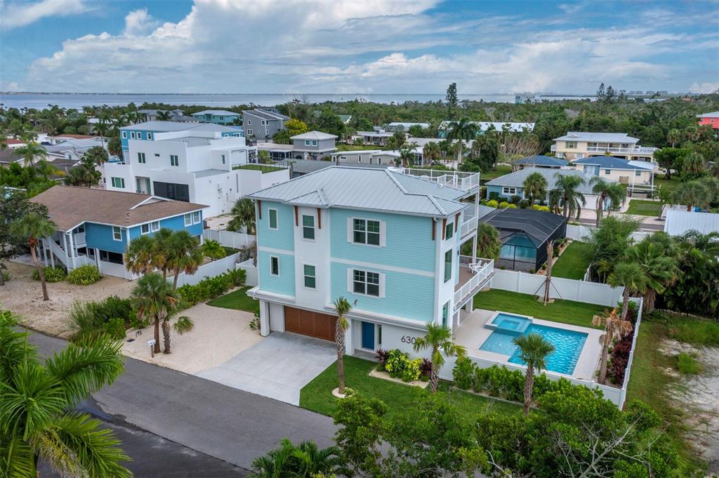 630 Companion Way Longboat Key, FL 34228 - Photo 4 of 66 an aerial view of multiple houses with a yard
