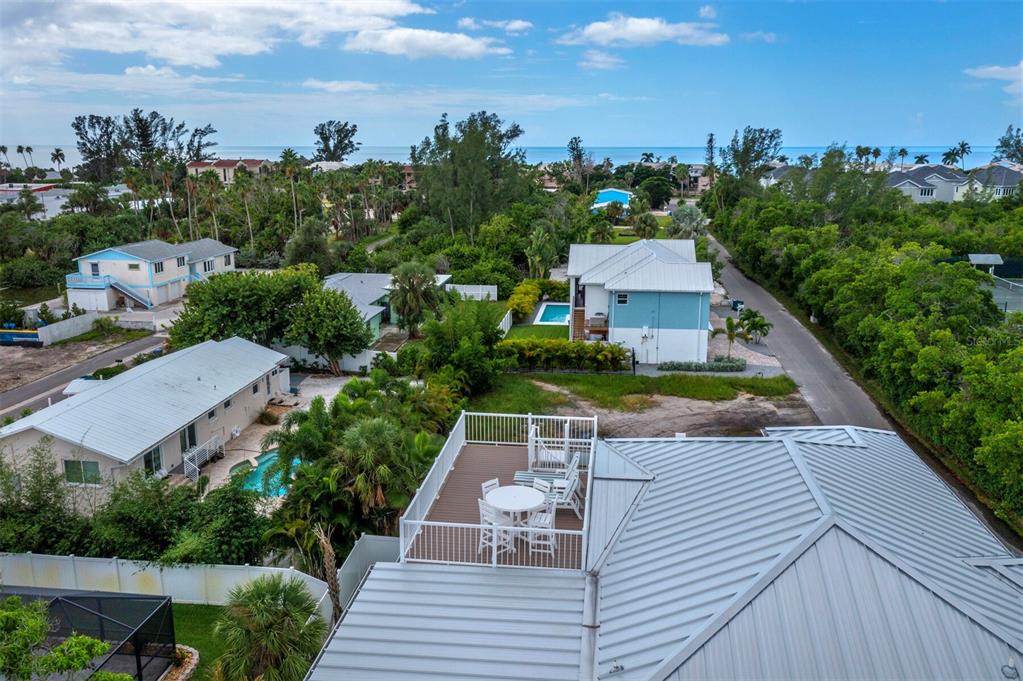630 Companion Way Longboat Key, FL 34228 - Photo 44 of 66 an aerial view of multiple houses with a yard