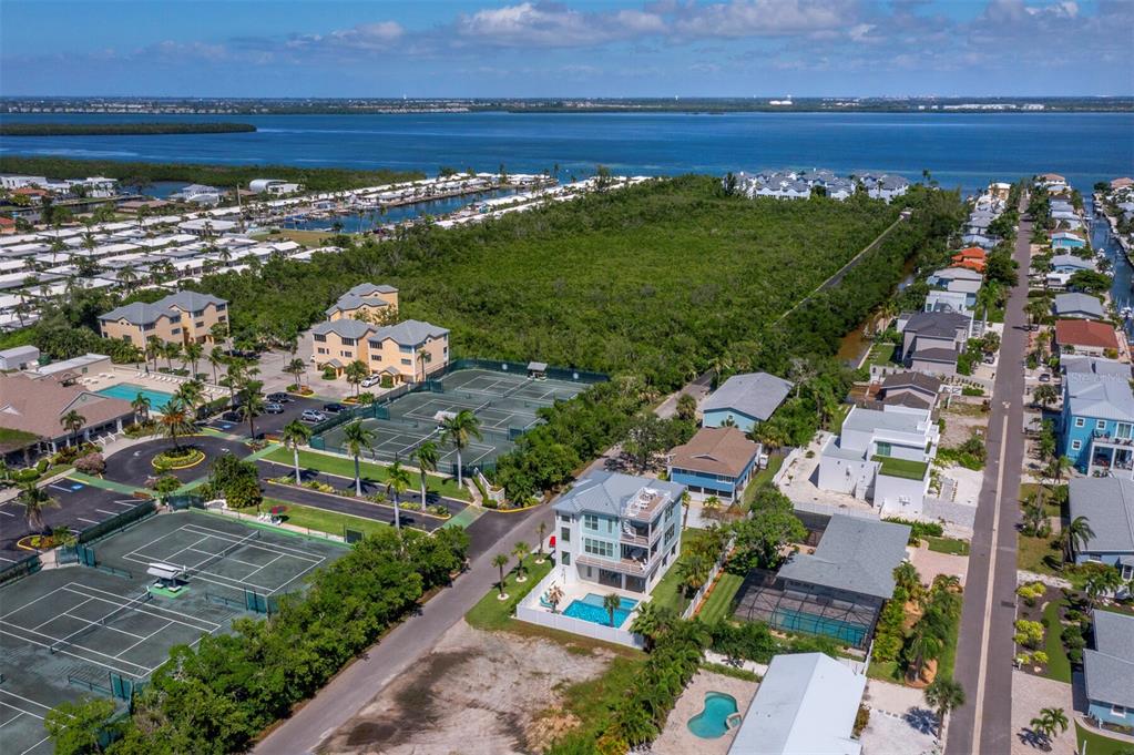 630 Companion Way Longboat Key, FL 34228 - Photo 54 of 66 an aerial view of a house with a lake view
