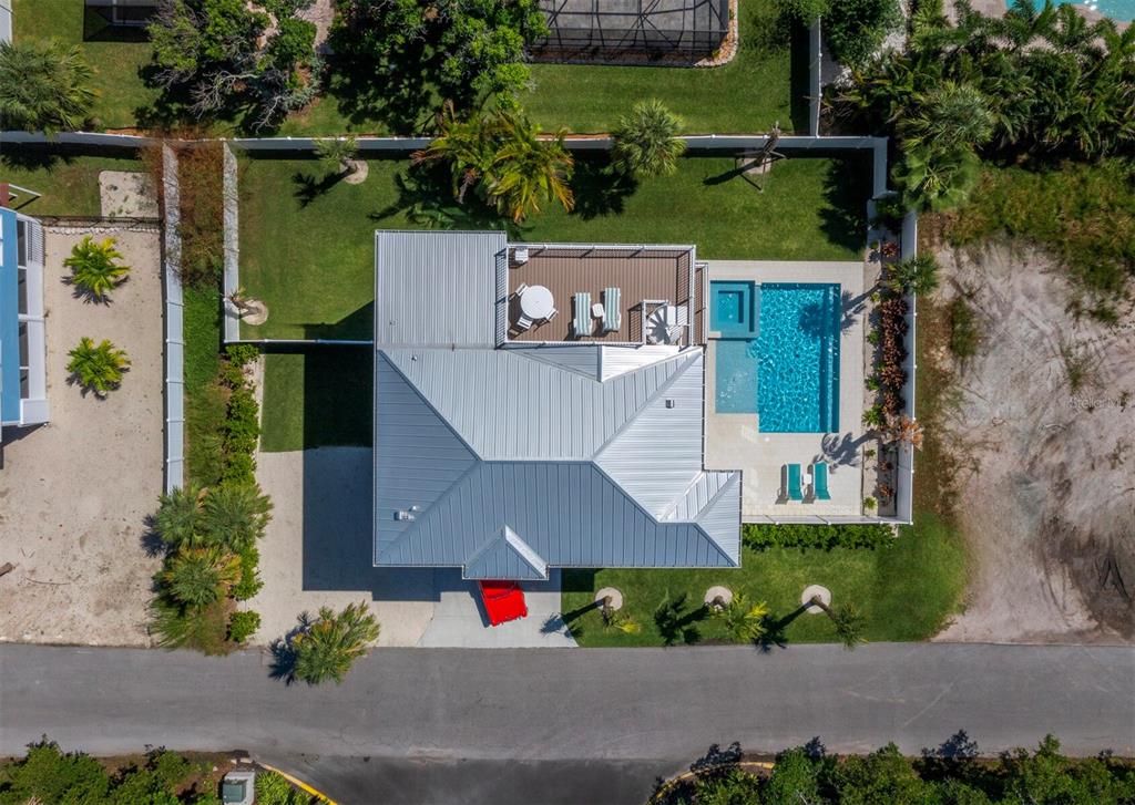 630 Companion Way Longboat Key, FL 34228 - Photo 59 of 66 an aerial view of a house with a yard and outdoor seating