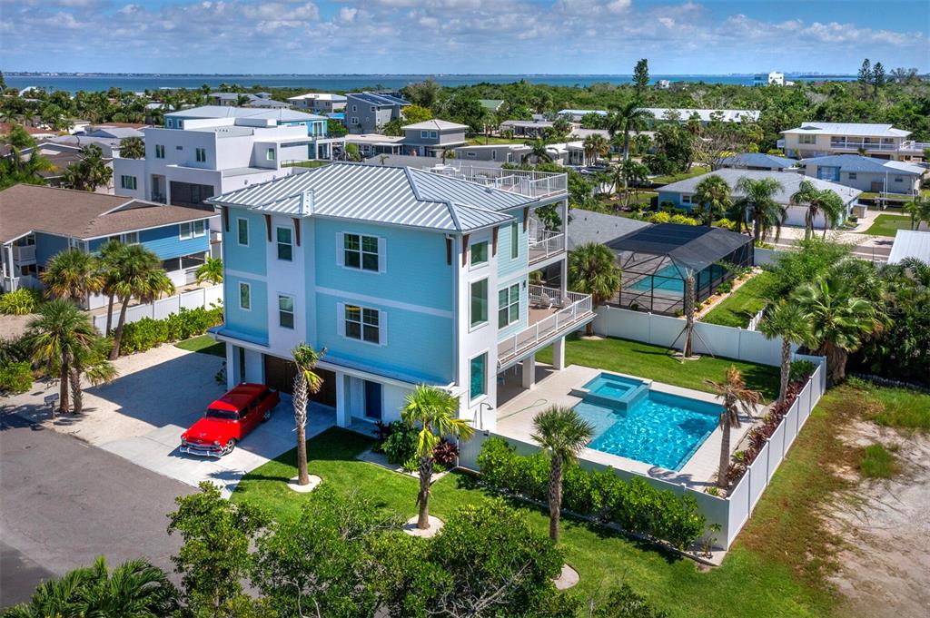 630 Companion Way Longboat Key, FL 34228 - Photo 64 of 66 an aerial view of multiple houses with a yard