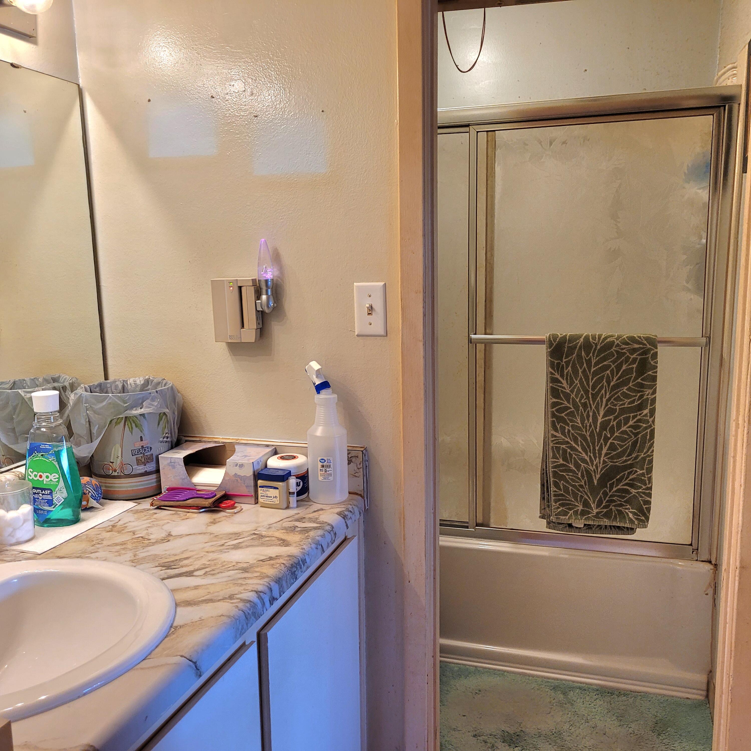 210 Pelham Road, Unit 208C Fort Walton Beach, FL 32547 - Photo 5 of 17 a bathroom with a granite countertop sink and a mirror
