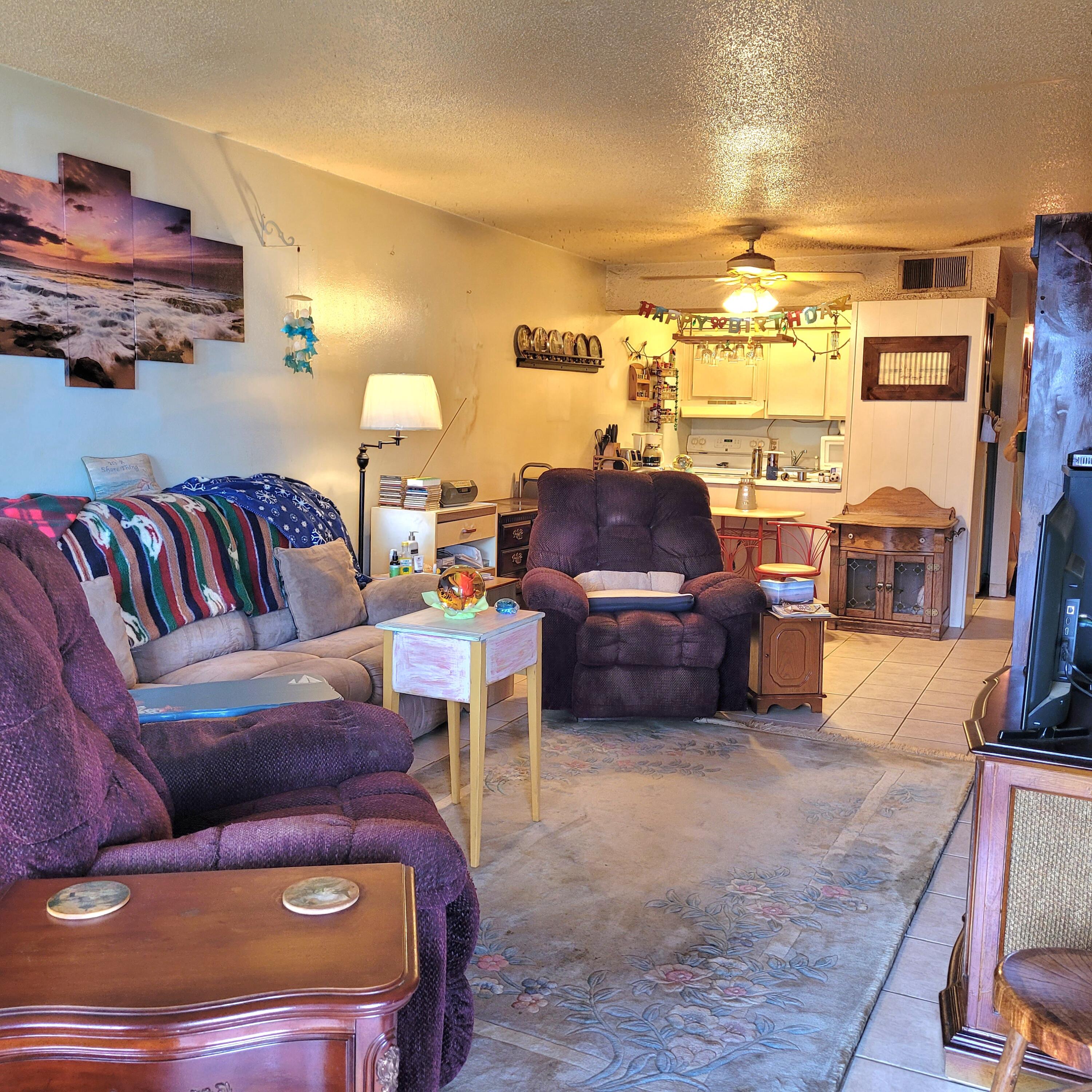 210 Pelham Road, Unit 208C Fort Walton Beach, FL 32547 - Photo 8 of 17 a living room with furniture and a fireplace