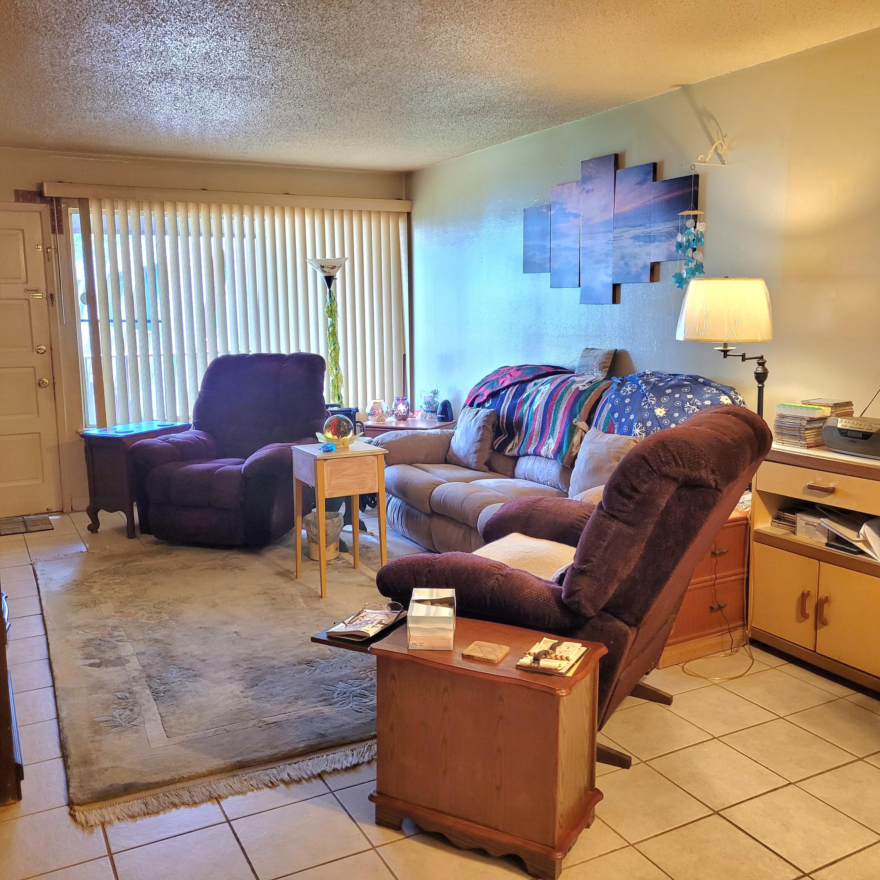210 Pelham Road, Unit 208C Fort Walton Beach, FL 32547 - Photo 9 of 17 a living room with furniture and a window