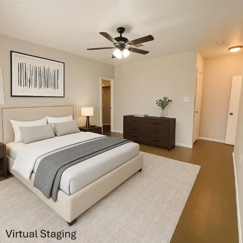 a bedroom with bed and a dresser