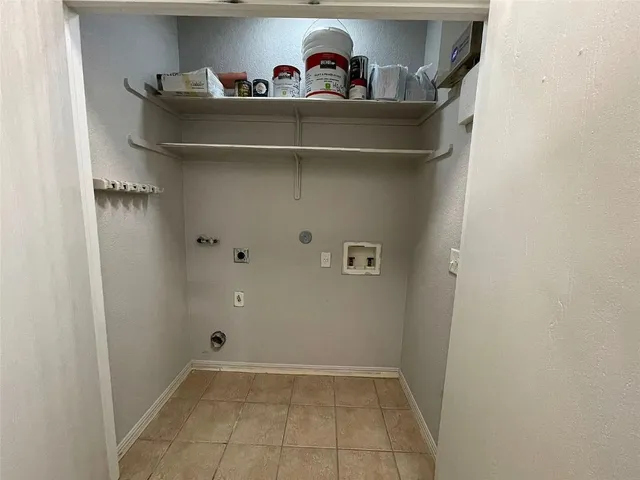 a view of a closet with racks on the wall