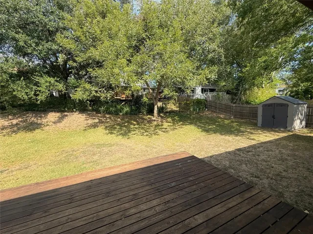 a view of a backyard of the house