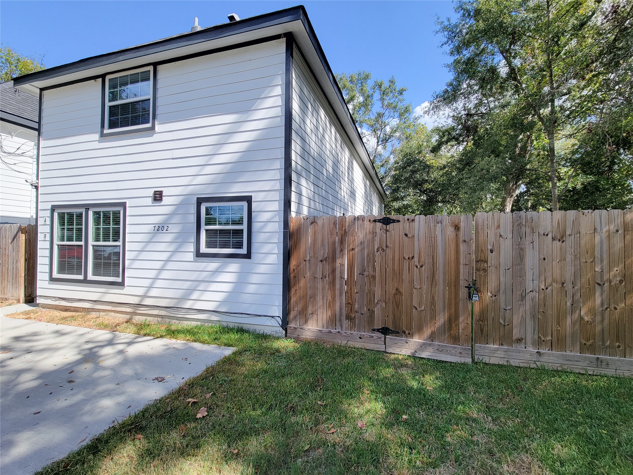 7202 Sandle Street, Unit A Houston, TX 77088 - Photo 1 of 29 a view of a house with backyard and wooden fence