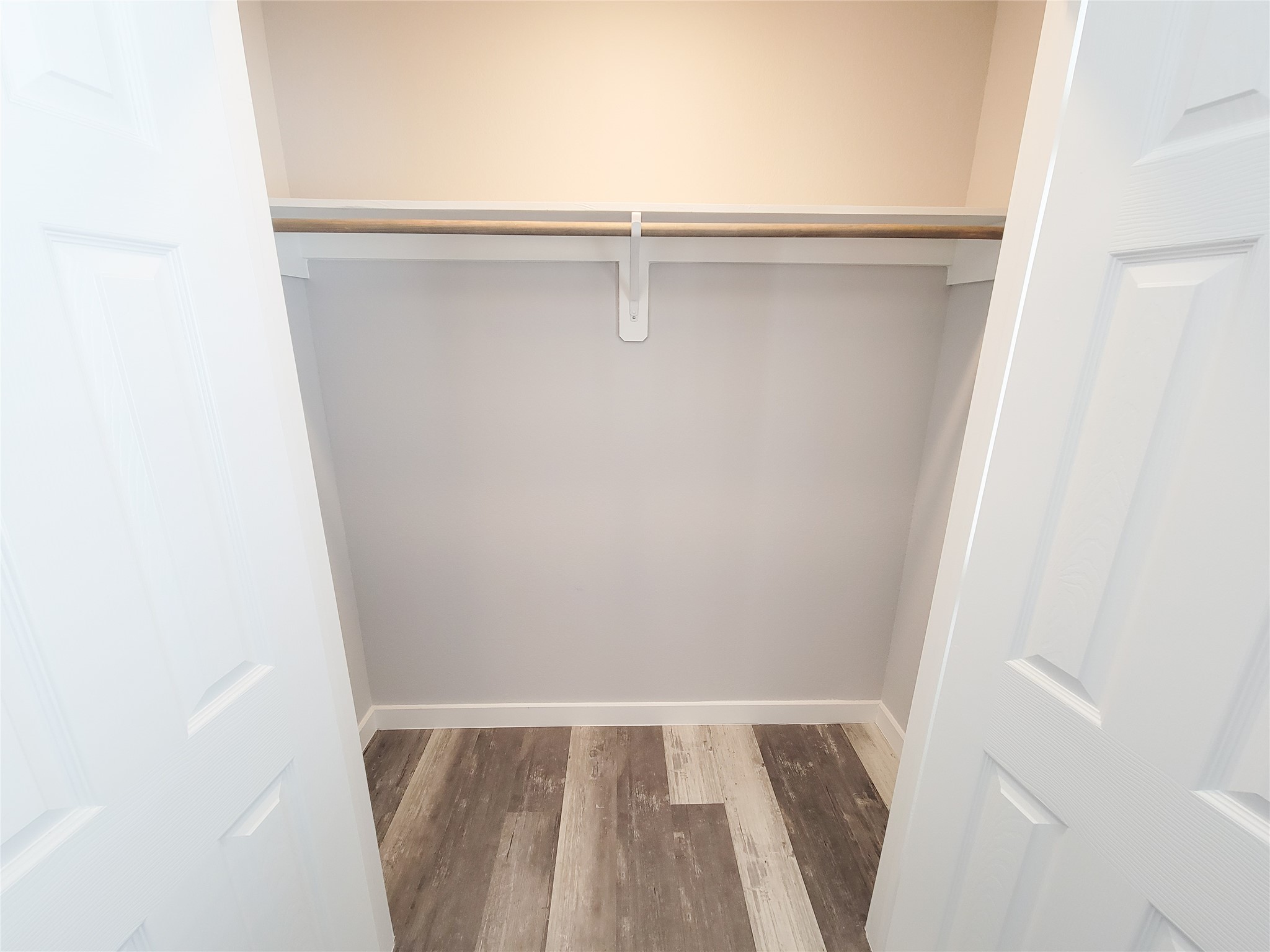7202 Sandle Street, Unit A Houston, TX 77088 - Photo 12 of 29 a view of walk in closet with empty racks