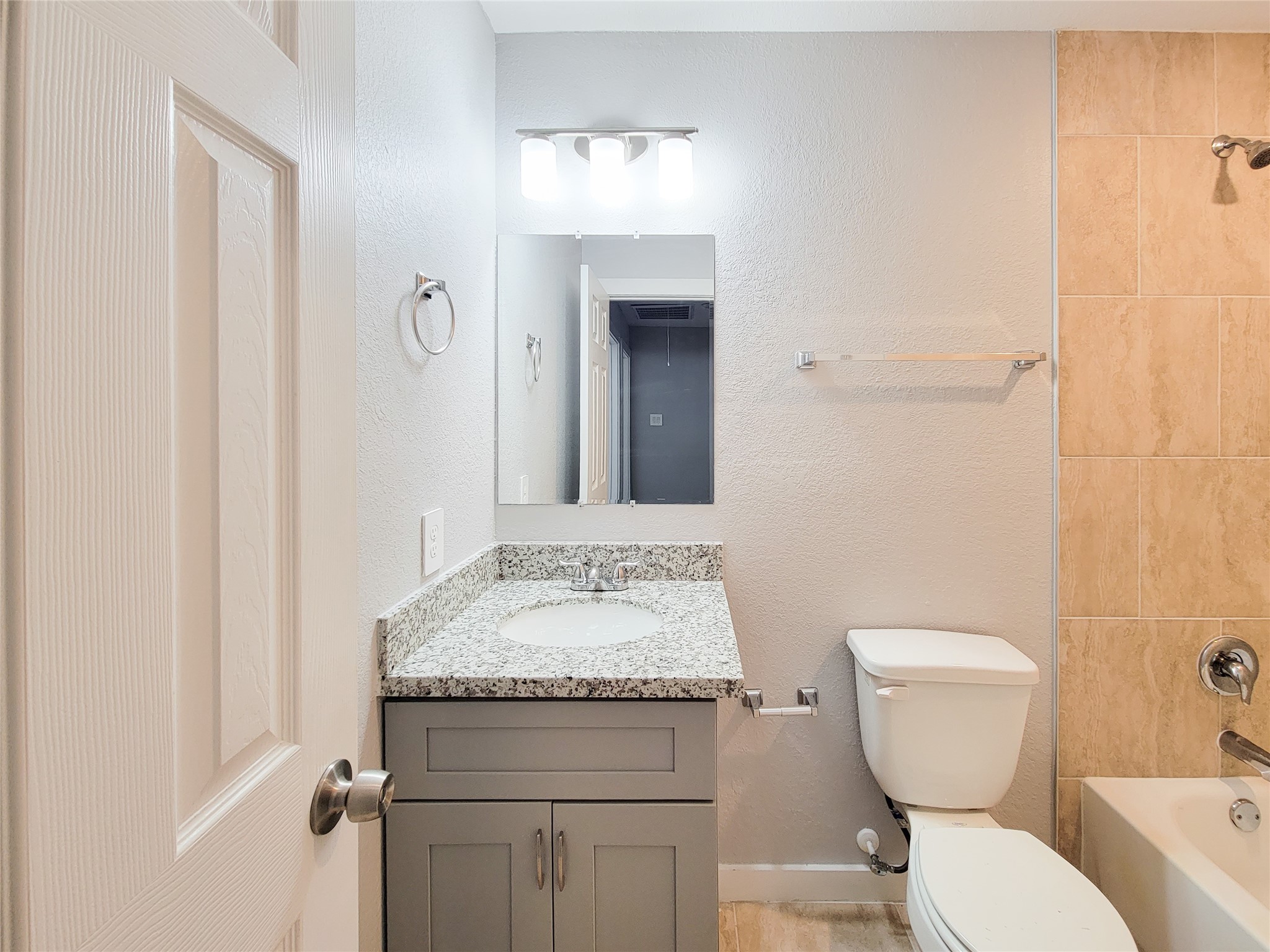 7202 Sandle Street, Unit A Houston, TX 77088 - Photo 22 of 29 a bathroom with a toilet sink and mirror