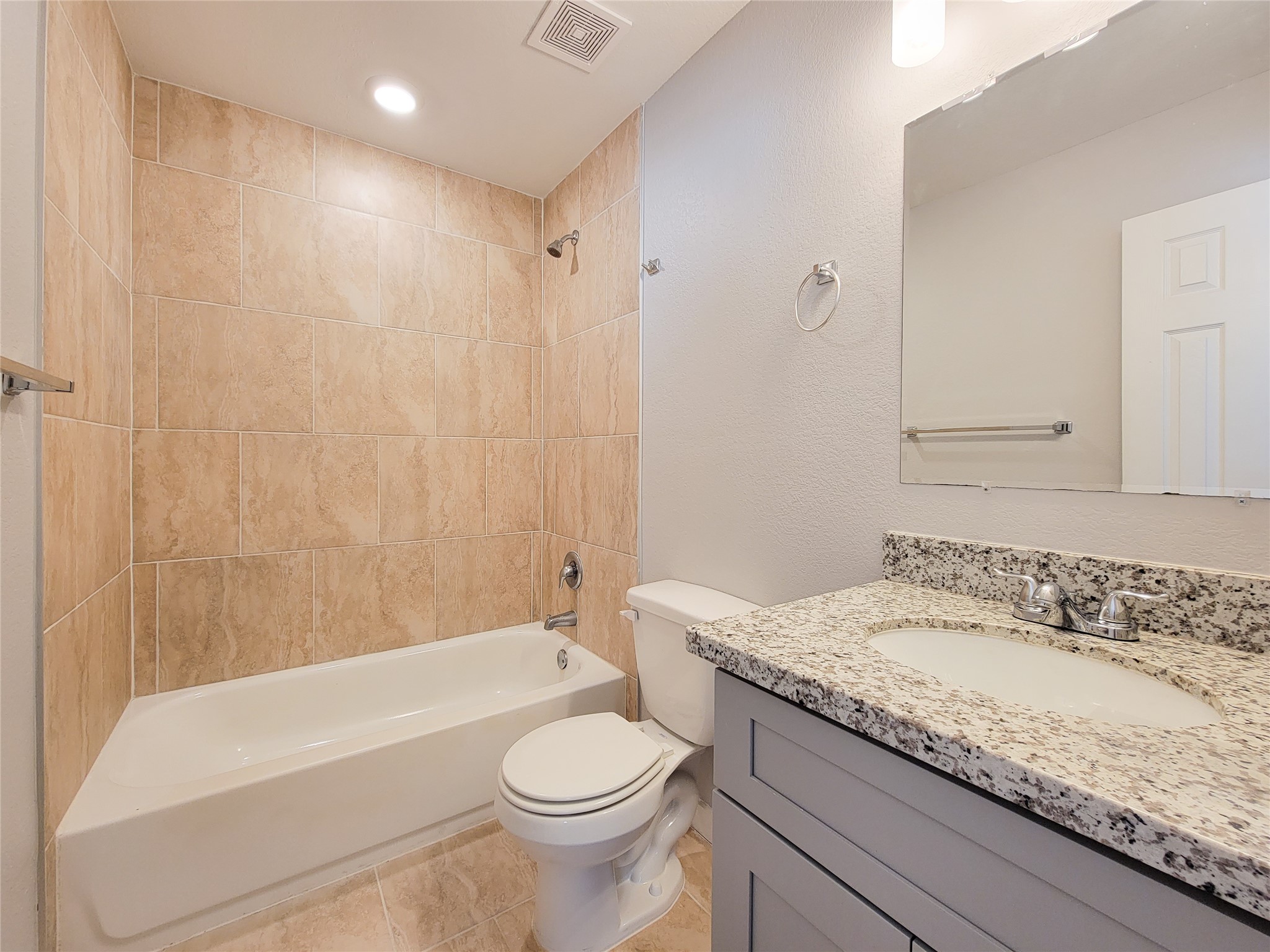 7202 Sandle Street, Unit A Houston, TX 77088 - Photo 24 of 29 a bathroom with a granite countertop sink a toilet and bathtub