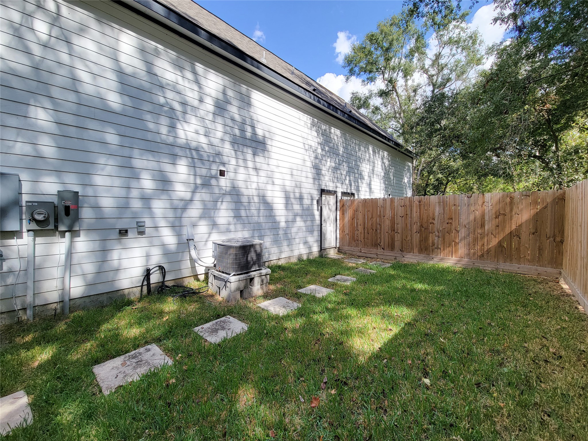 7202 Sandle Street, Unit A Houston, TX 77088 - Photo 29 of 29 a view of backyard with large trees