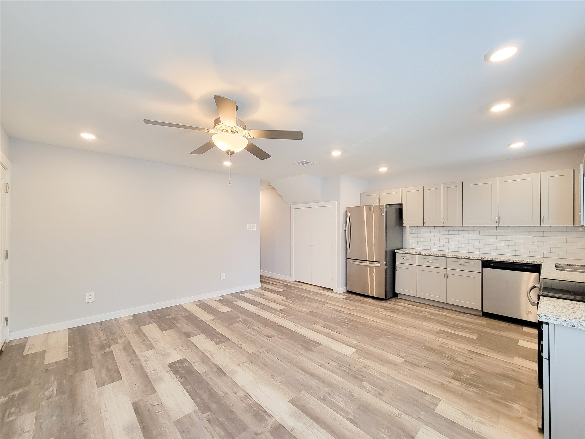 7202 Sandle Street, Unit A Houston, TX 77088 - Photo 6 of 29 a view of a kitchen with a sink and stainless steel appliances