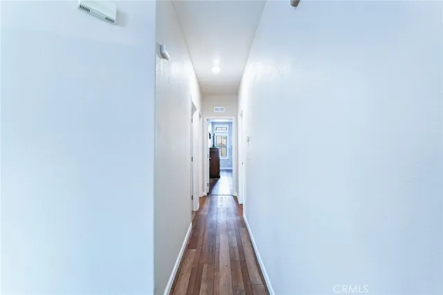 a bedroom with bed and a chandelier