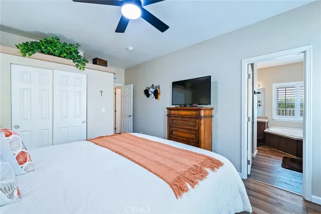 a spacious bathroom with a toilet sink and mirror