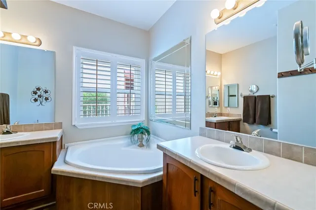 a en suite bathroom with a sink and a mirror