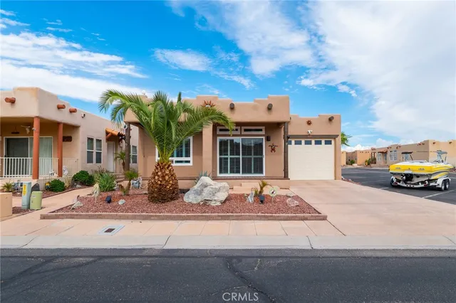 a house view with a sitting space and garden space