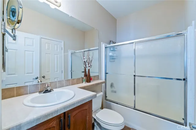 a balcony with furniture and garden view