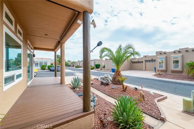 a living room with furniture a chandelier and a window