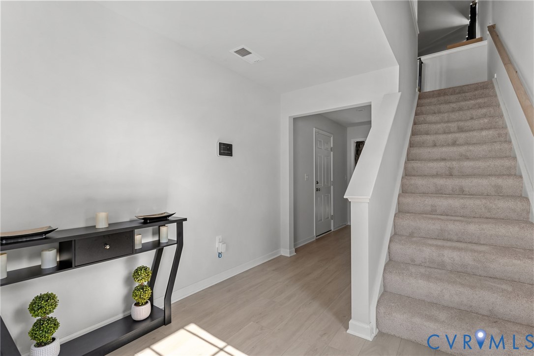 640 Rivanna Hill Road Glen Allen, VA 23060 - Photo 6 of 37 Carpeted staircase with light wood-finish flooring