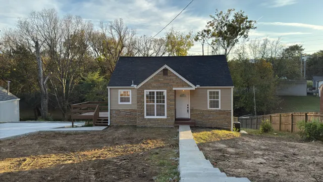 a front view of a house with garden