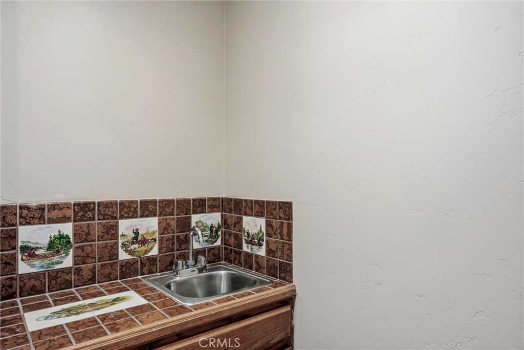 19474 Donkey Hill Road Hidden Valley Lake, CA 95467 - Photo 20 of 38 Cute wet bar in hallway.