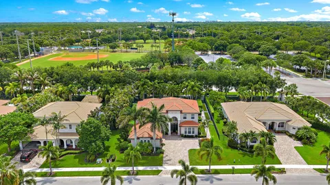 an aerial view of multiple houses with yard