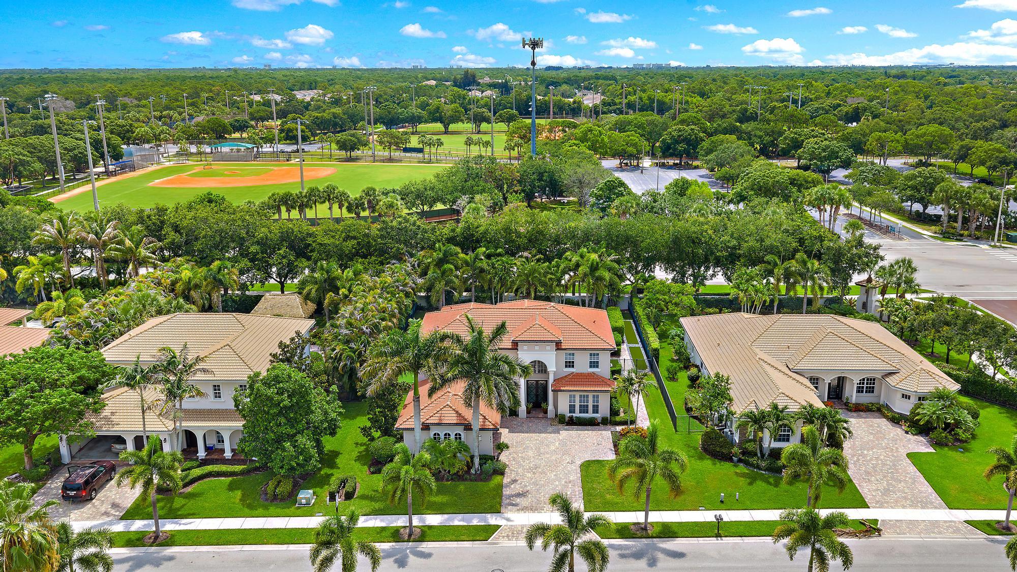 283 Rudder Cay Way Jupiter, FL 33458 - Photo 23 of 41 an aerial view of a house with a garden and lake view