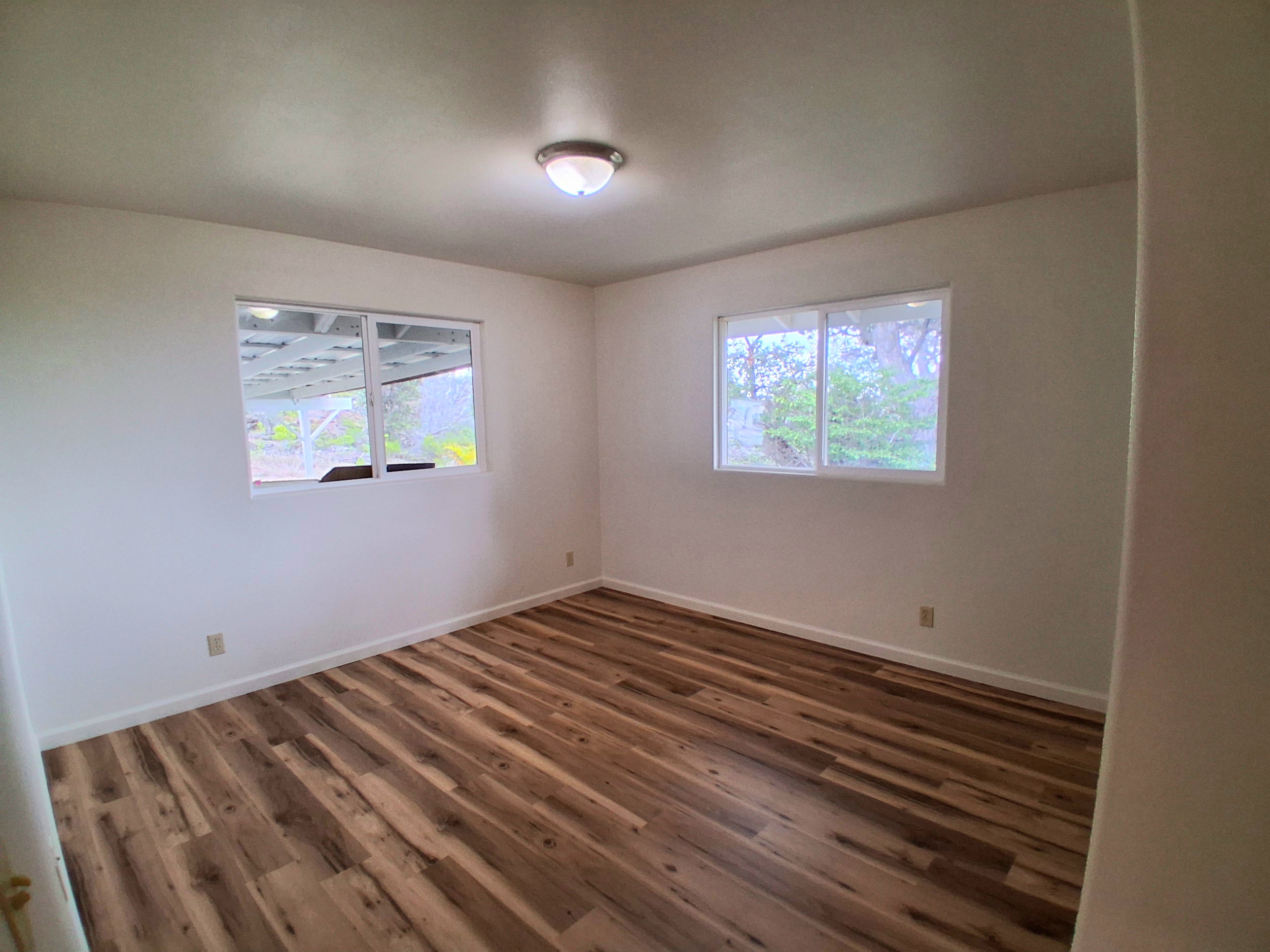 92-8221 Reef Parkway Ocean View, HI 96704 - Photo 15 of 20 an empty room with windows