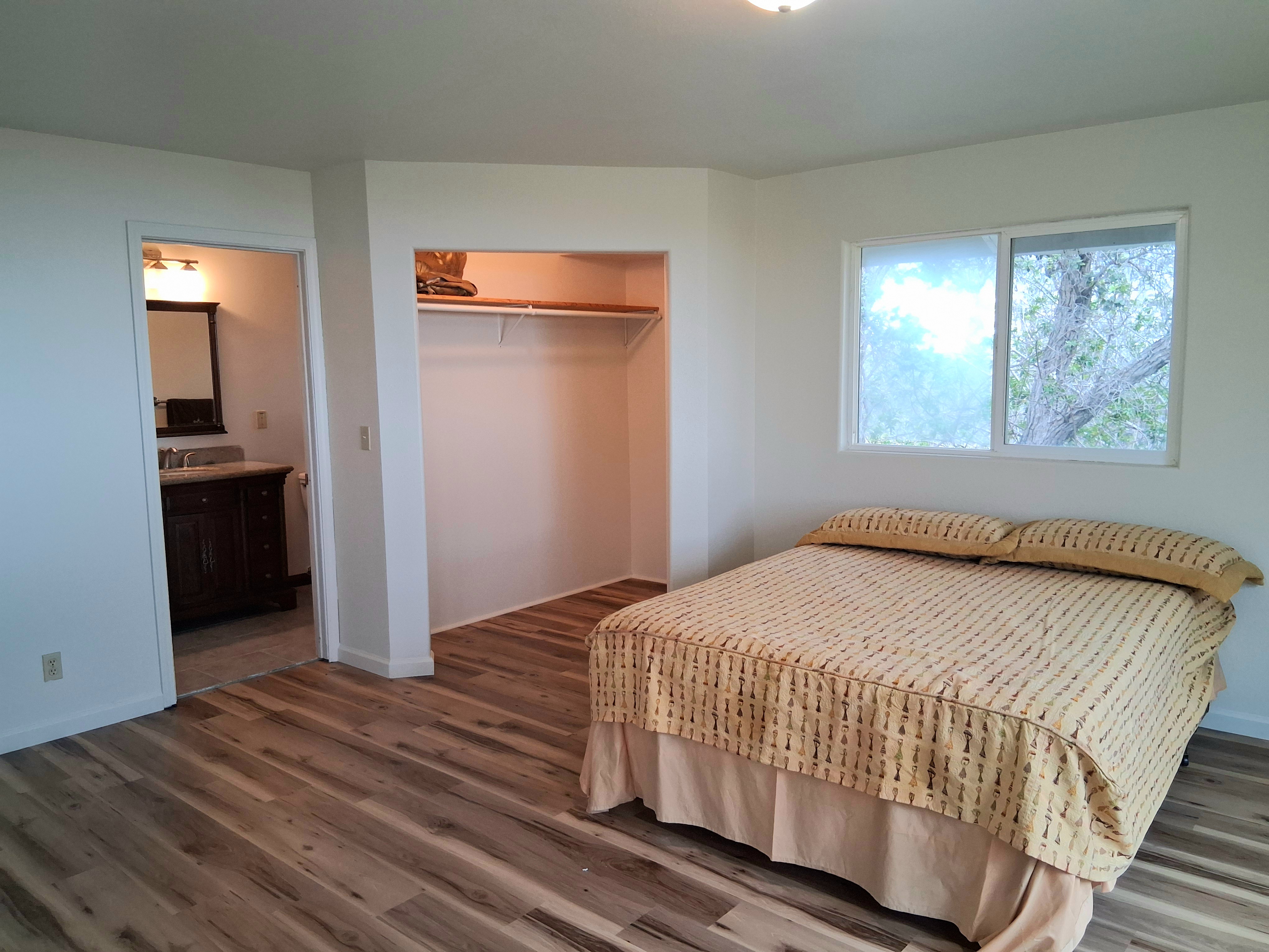 92-8221 Reef Parkway Ocean View, HI 96704 - Photo 10 of 20 a bedroom with a bed and a window
