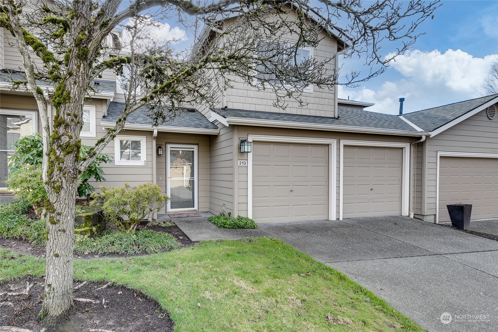 1430 West Casino Road, Unit 213 Everett, WA 98204 - Photo 1 of 31 front view of a house with a small yard