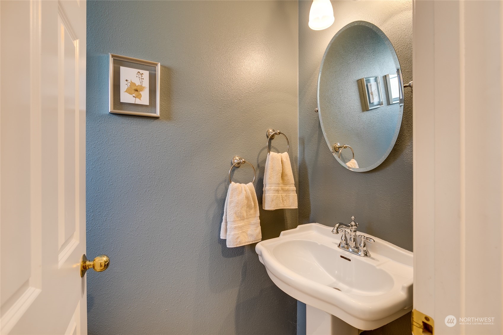 1430 West Casino Road, Unit 213 Everett, WA 98204 - Photo 11 of 31 a bathroom with a sink and a mirror