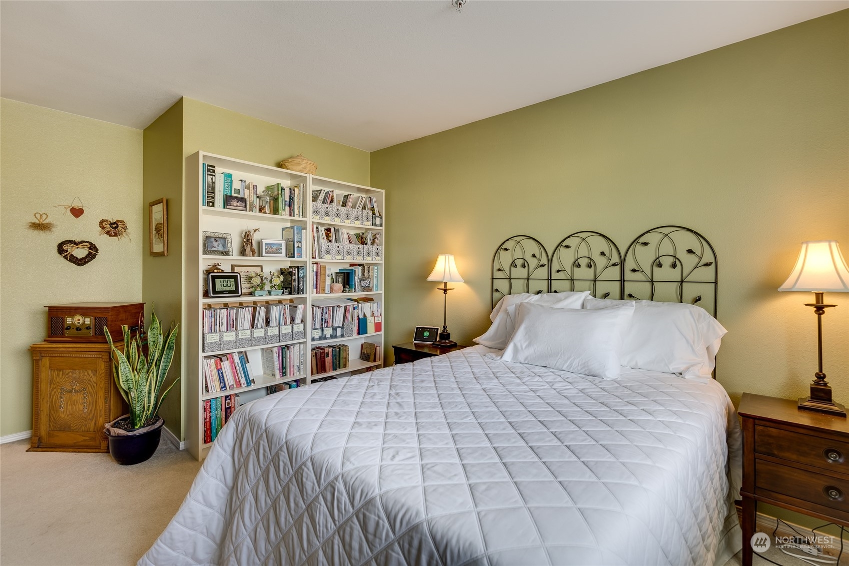 1430 West Casino Road, Unit 213 Everett, WA 98204 - Photo 13 of 31 a bedroom with a bed a books bucket with a large window