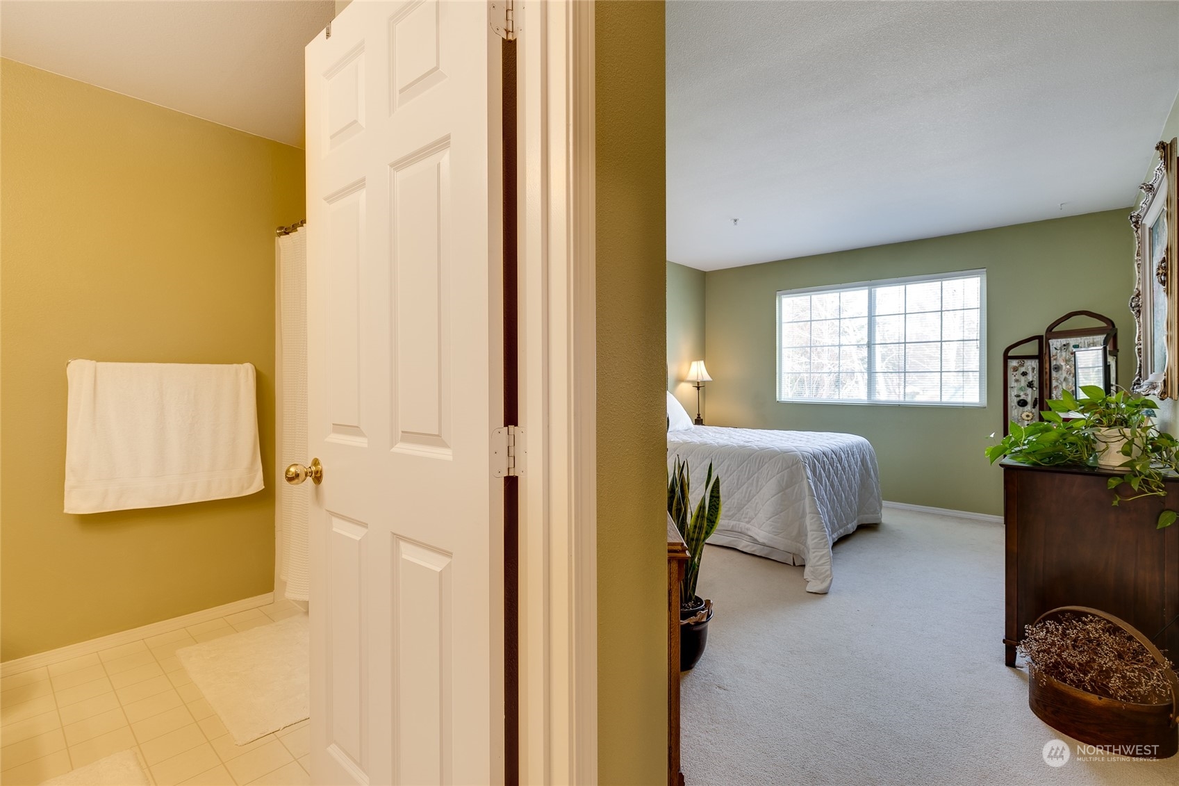 1430 West Casino Road, Unit 213 Everett, WA 98204 - Photo 16 of 31 a bedroom with a bed and a window