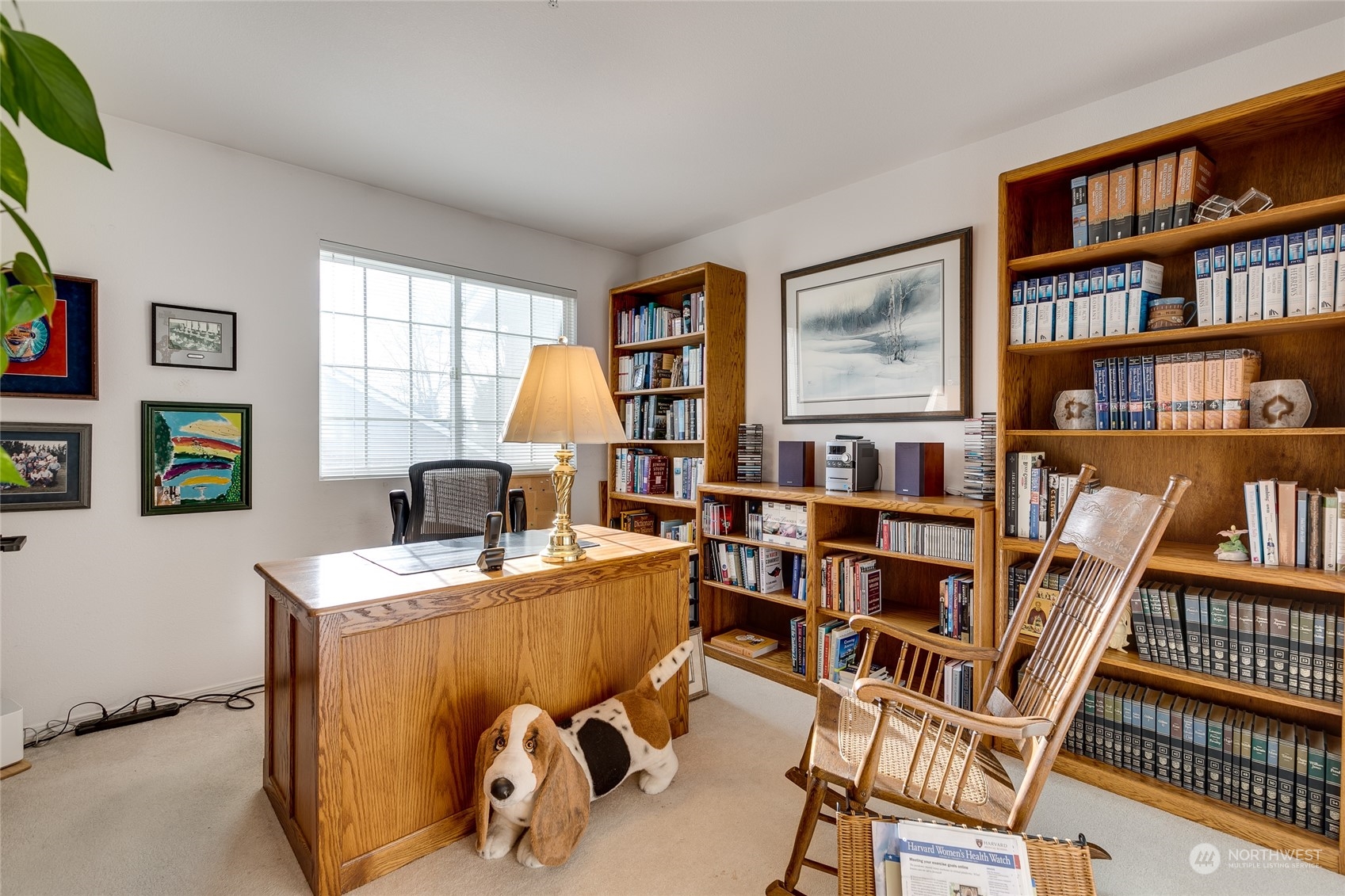 1430 West Casino Road, Unit 213 Everett, WA 98204 - Photo 20 of 31 a view of a workspace with furniture and a bookshelf