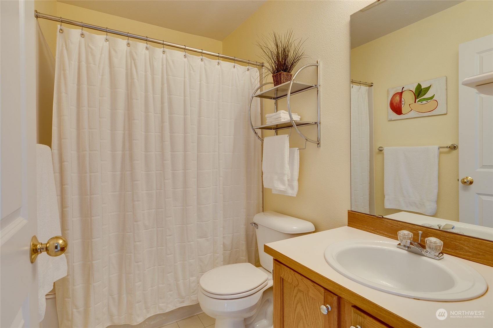 1430 West Casino Road, Unit 213 Everett, WA 98204 - Photo 21 of 31 a bathroom with a sink toilet and shower