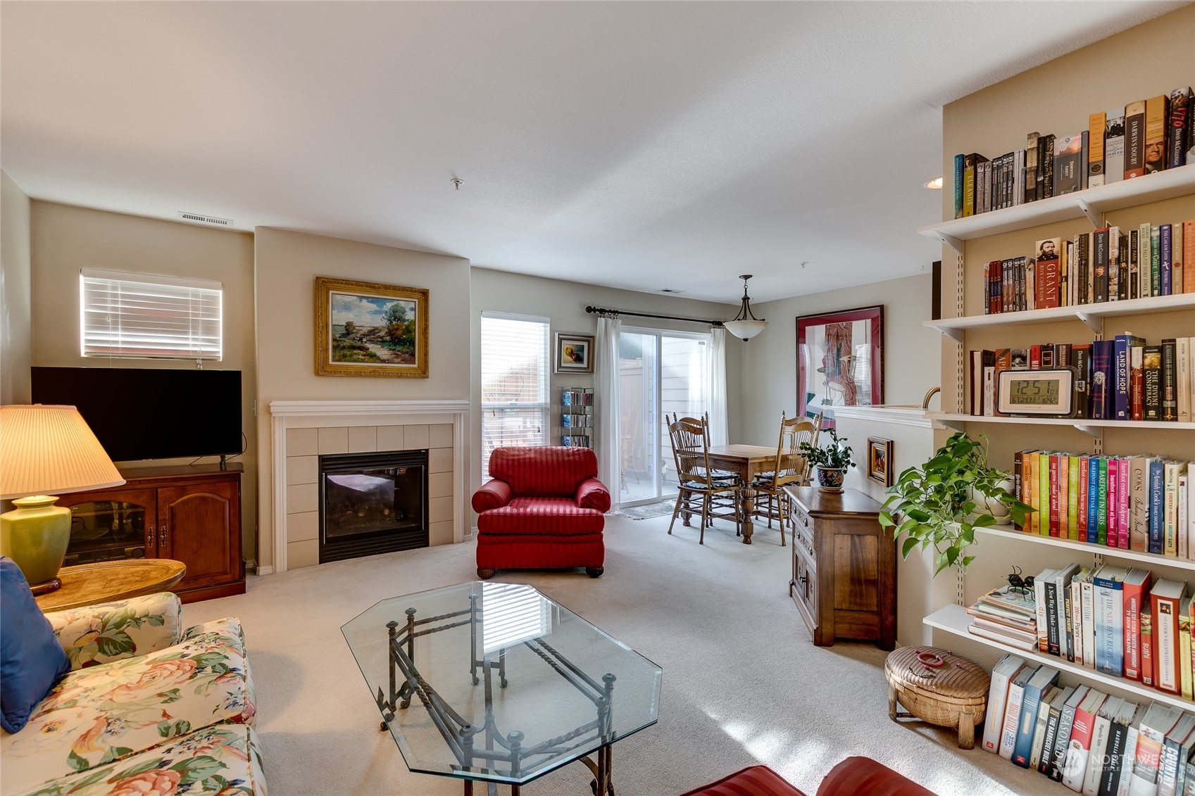 1430 West Casino Road, Unit 213 Everett, WA 98204 - Photo 6 of 31 a living room with furniture and a book shelf