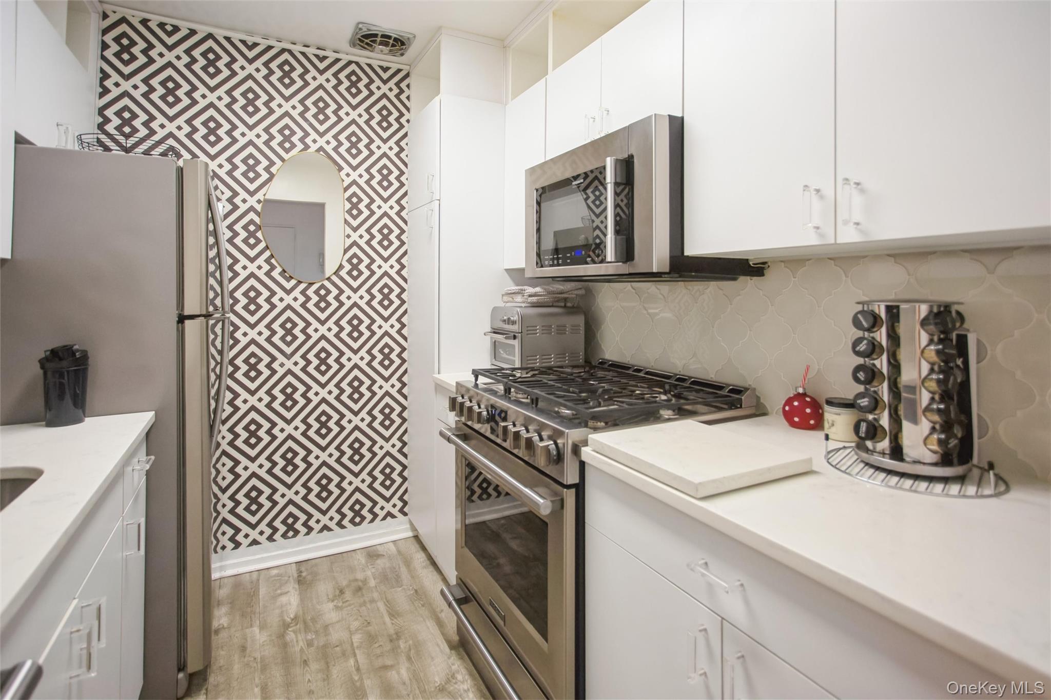 a kitchen with sink and cabinets