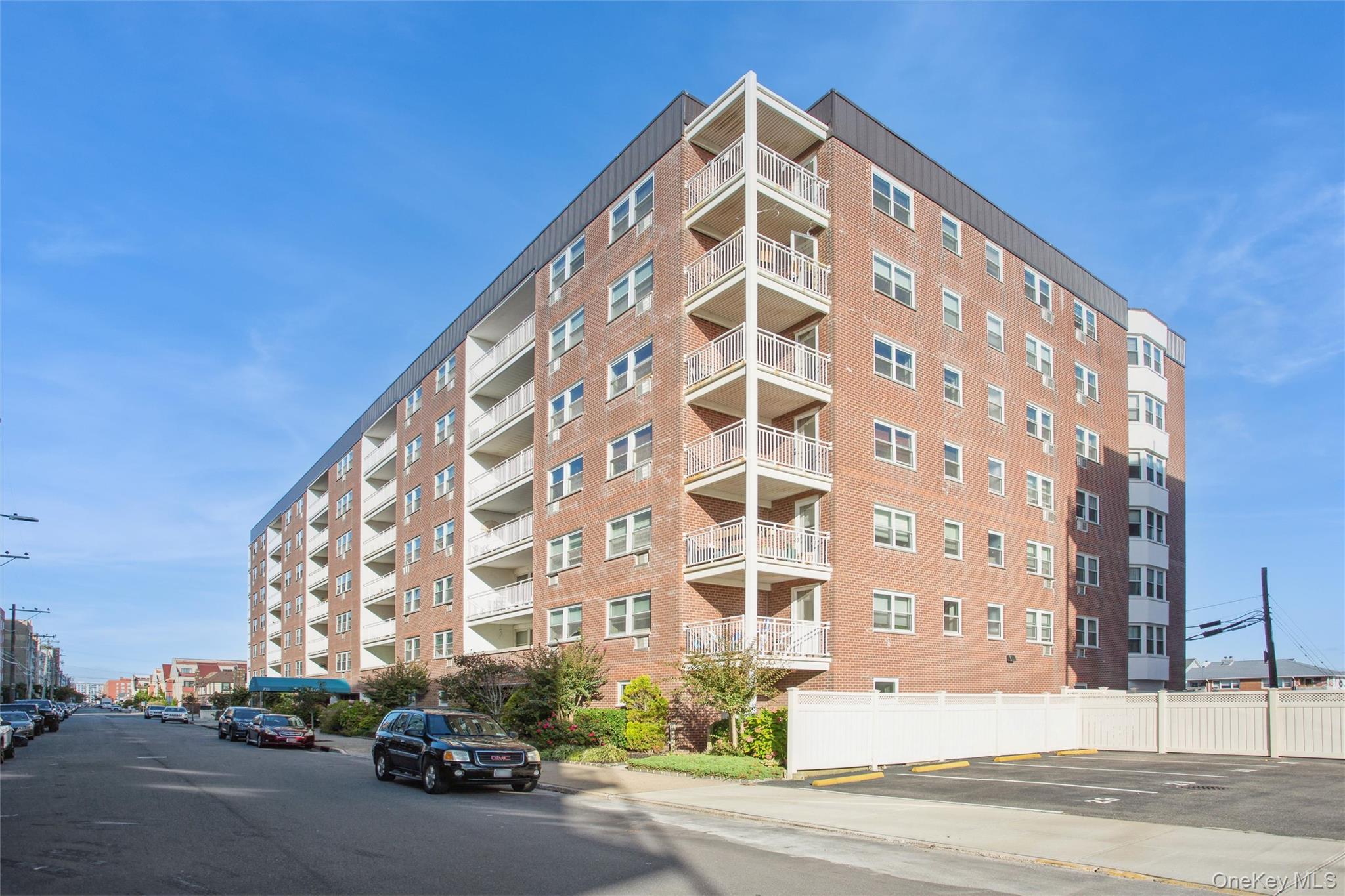 711 Shore Road, Unit 2C Long Beach, NY 11561 - Photo 14 of 27 a view of a tall building next to a road