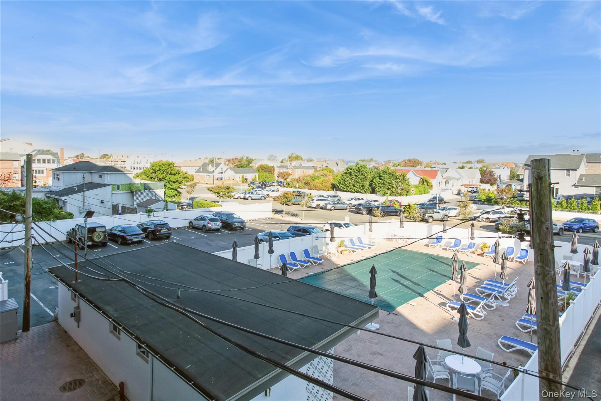 711 Shore Road, Unit 2C Long Beach, NY 11561 - Photo 18 of 27 a view of a balcony with an ocean