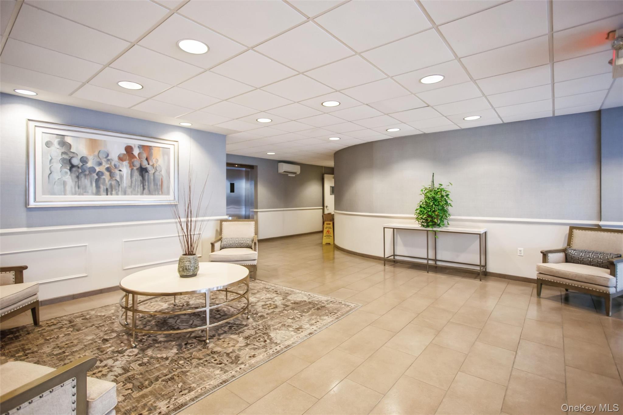 711 Shore Road, Unit 2C Long Beach, NY 11561 - Photo 26 of 27 a living room with furniture and a table