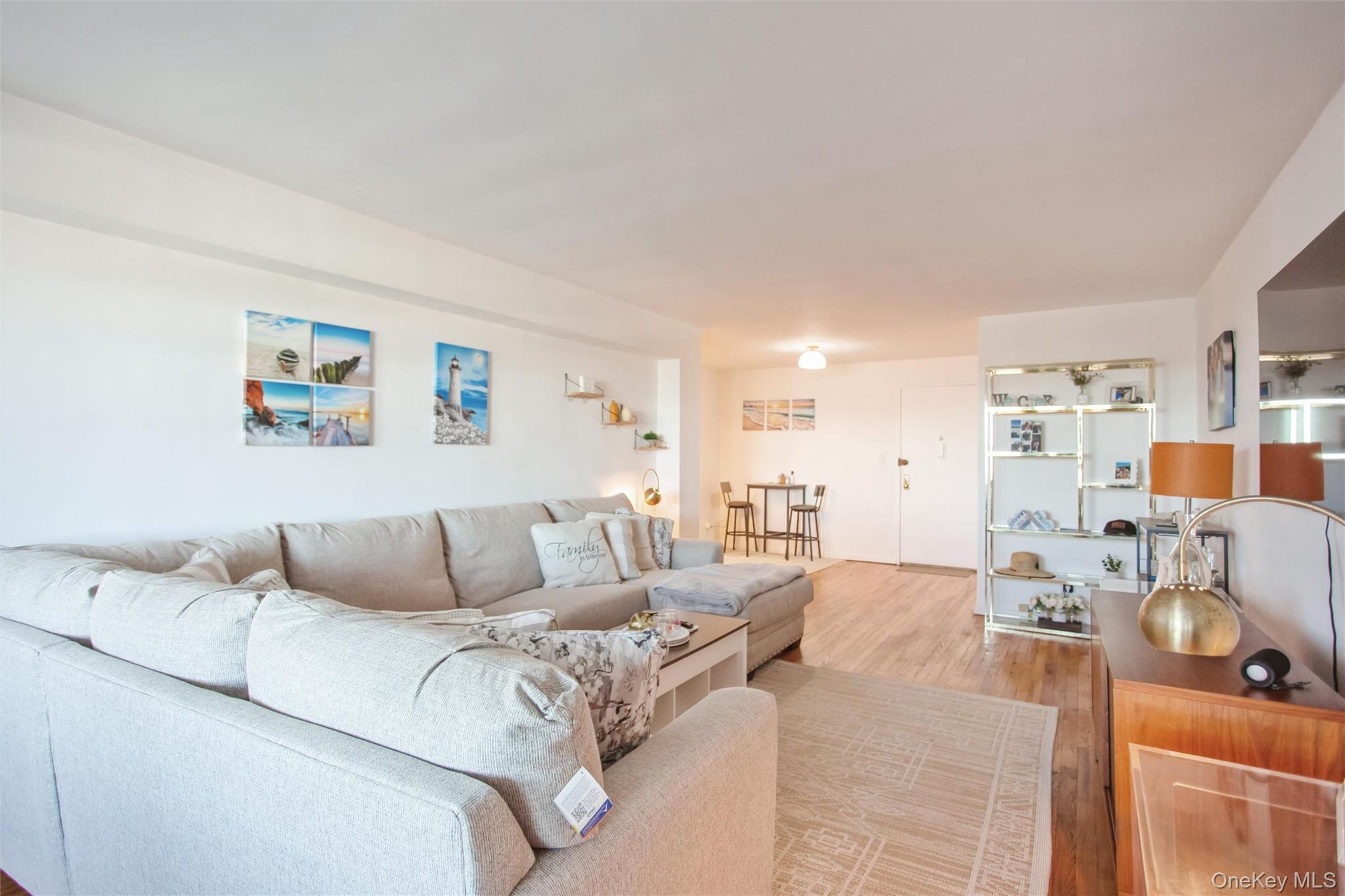 711 Shore Road, Unit 2C Long Beach, NY 11561 - Photo 5 of 27 a living room with furniture and a couch