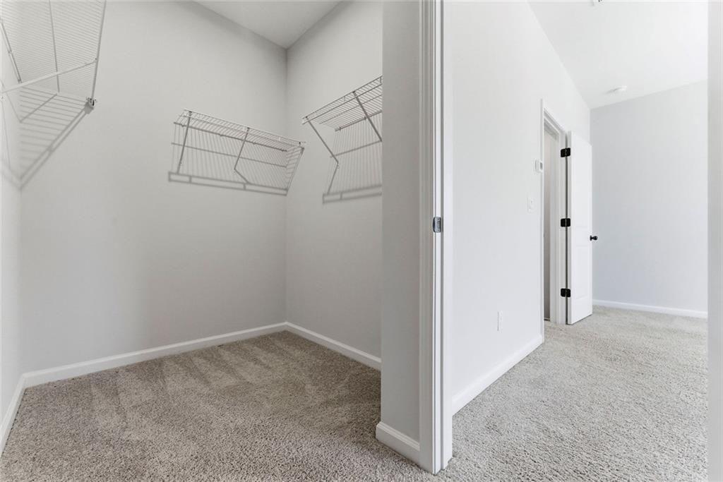 1200 Marlo Way Acworth, GA 30102 - Photo 16 of 34 a view of a room with racks on the wall