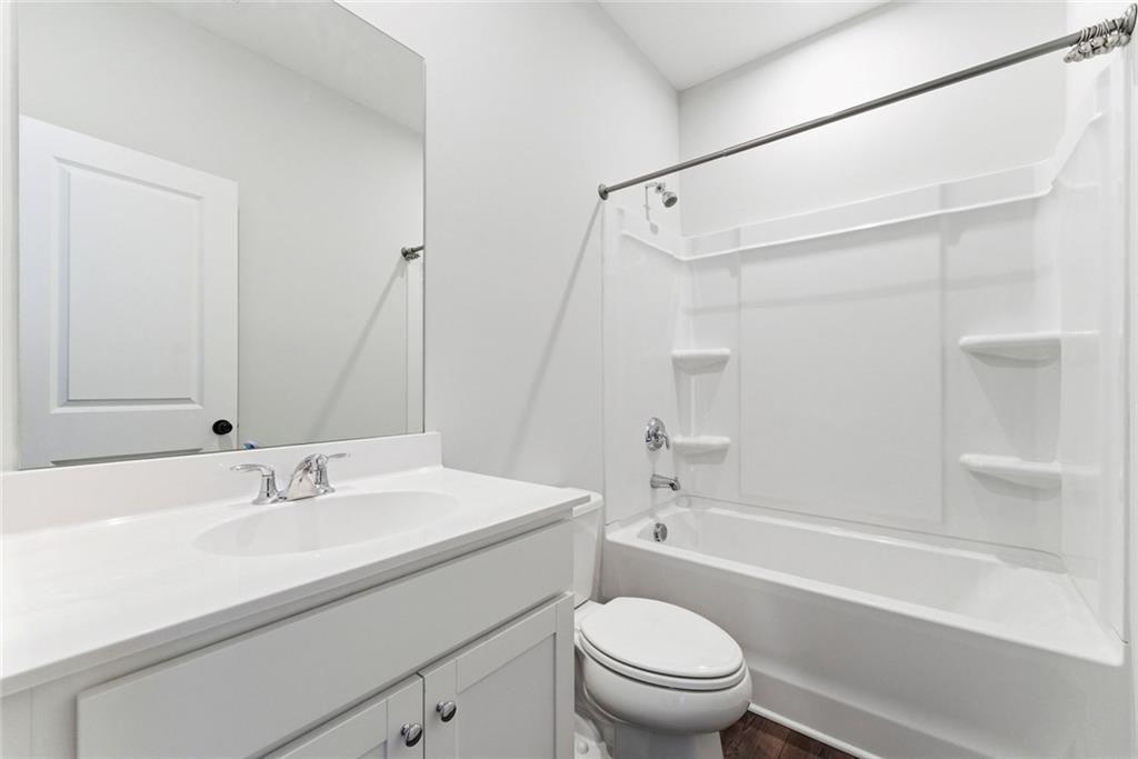 1200 Marlo Way Acworth, GA 30102 - Photo 20 of 34 a bathroom with a sink a toilet and a bathtub