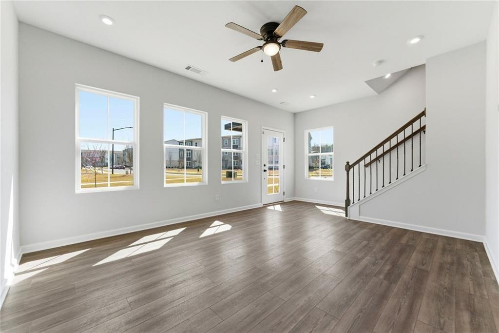 1200 Marlo Way Acworth, GA 30102 - Photo 4 of 34 a view of an empty room with wooden floor and a window